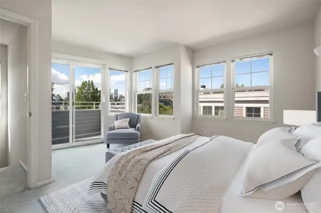 Primary bedroom with ensuite bathroom & walk in closet. Virtually staged to give you a sense of the room.