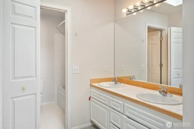 Primary bathroom with nice sized walk in closet