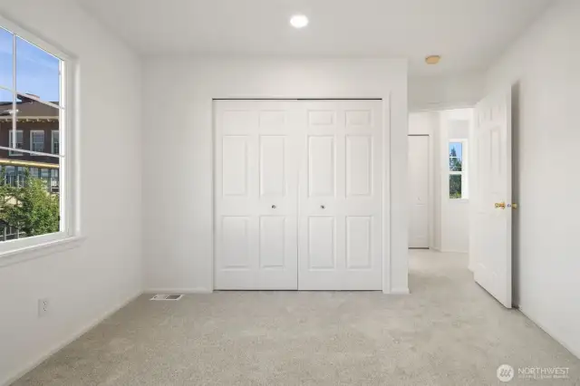Upper level bedroom showing fresh paint and carpets