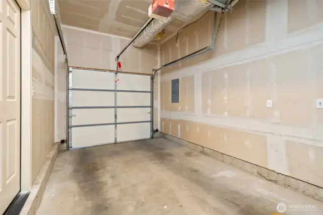 Private garage with space for storage - very tall. Easy to add EV charger.