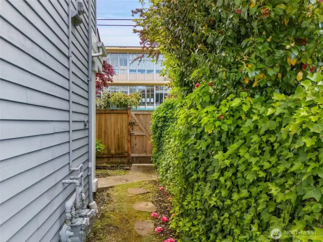 Private entry gate from sidewalk and fenced side yard area