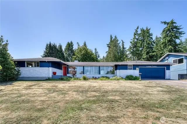 Nothing but upside with this 3160 sqft daylight basement home perfectly situated on a .91 acre lot that offers Sound and Mountain views.  The 3160 sqft, daylight basement home offers opportunities for mutigenerational living and many other uses for it's ample spaces with living spaces on both levels