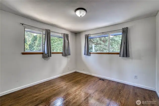 One of the three main level bedrooms that include the primary suite.