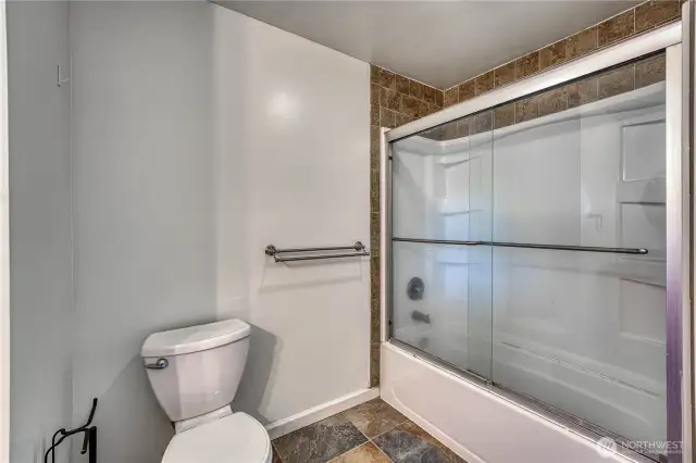 Shower, tub combo in the HUGE primary bedrooms private bathroom