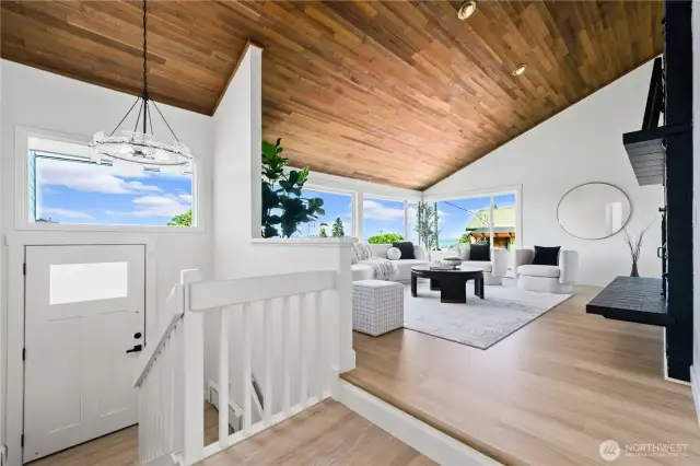 High wood ceilings and beautiful fireplace