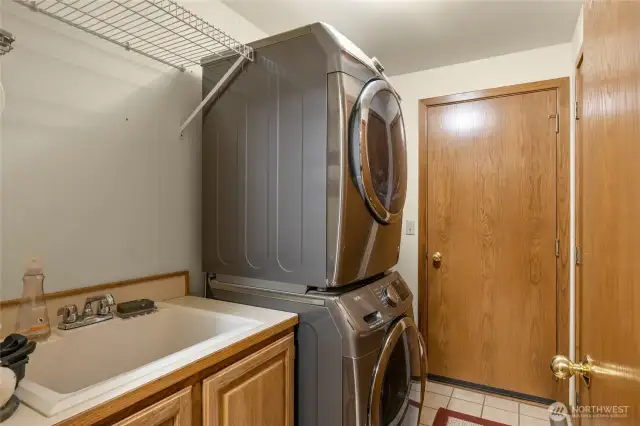 Main floor laundry room with exterior access.