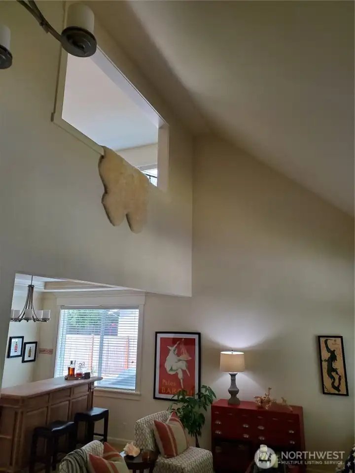 Formal dining room looking up to loft