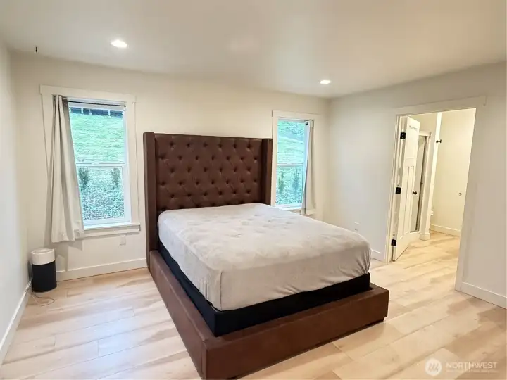 Primary bedroom with private bath and walk-in closet