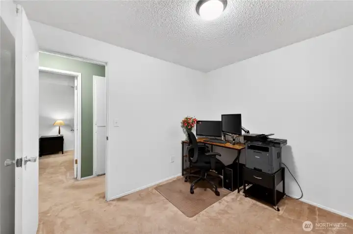 First bedroom looking into primary