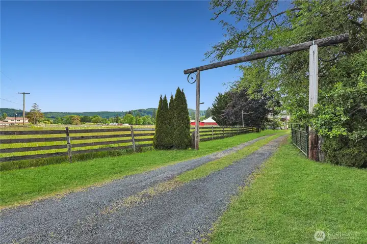 Beautiful tree lined drive leads to home and acreage.