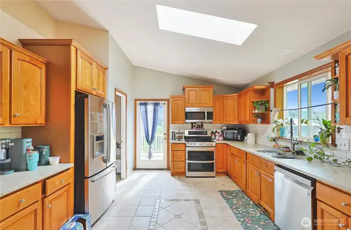 Quartz countertops and stainless appliances.