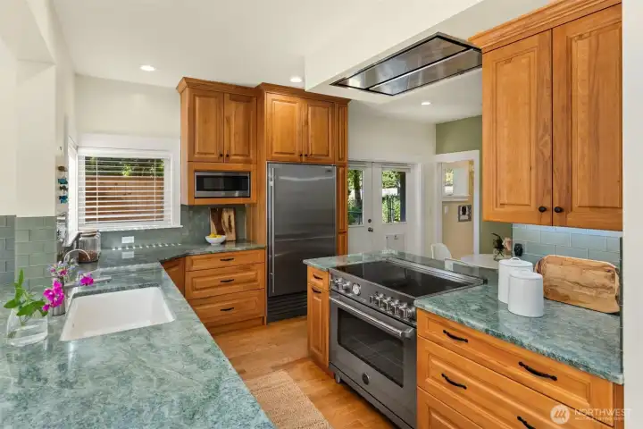 Bertazzoni induction cooktop and oven plus Sub-Zero fridge elevate your everyday culinary experience.