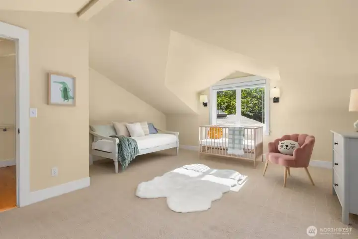 Bathed in natural light, this upper level bedroom feels both expansive and serene.