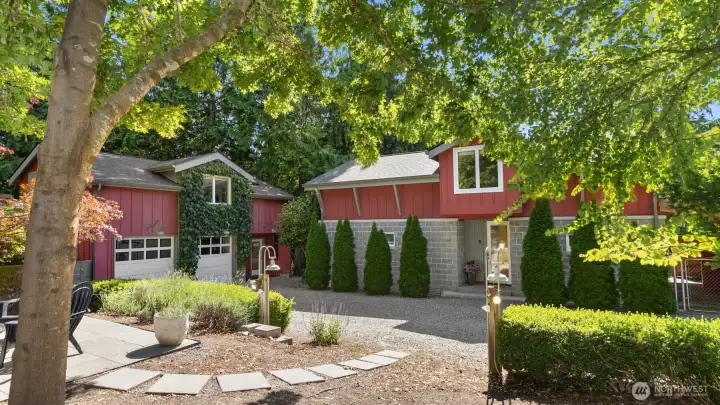 Above the garage, a beautifully finished 750 sqft bonus space offers exceptional flexibility, featuring a cozy gas fireplace, private bedroom, and room for guests, hobbies, creative pursuits, or a home office.
