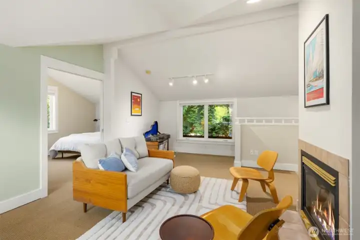 Versatile upper-level retreat perfect for work, relaxation, or hobbies complete with gas fireplace.