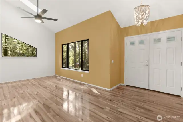 Bright living area that has 2 skylights. Both with remote retractable shades