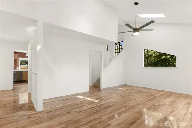 Living area showing stairs to upper floor