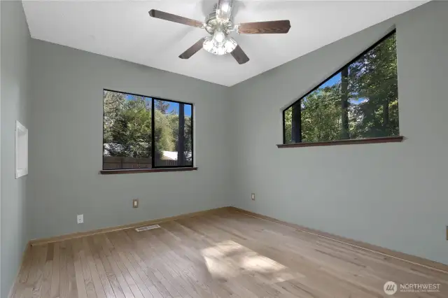 Versatile room next to kitchen that can be used as a den, dining room or office