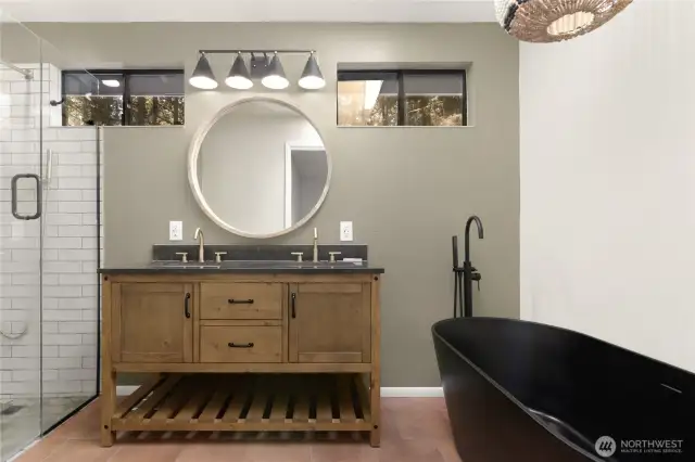 Fully remodeled primary bathroom. It even has a Bluetooth speaker in the kight.