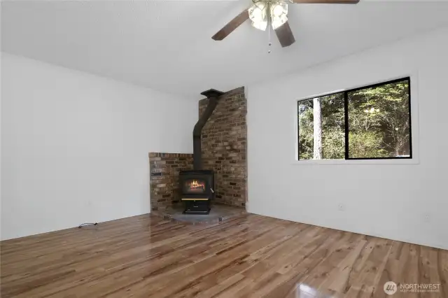 Living area off kitchen with wood stove
