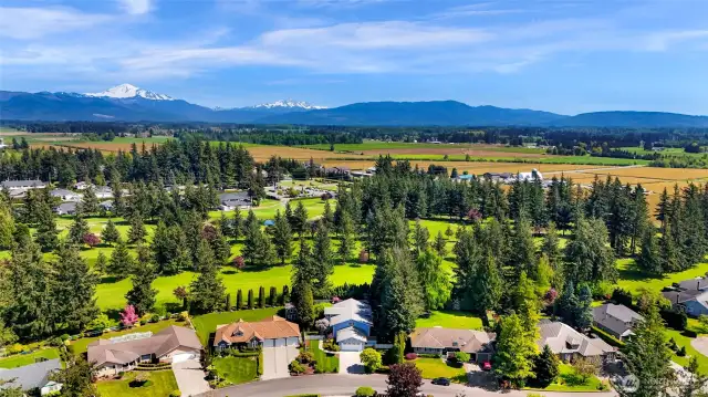 Aerial view looking over Raspberry Ridge Golf Course out to Mt Baker