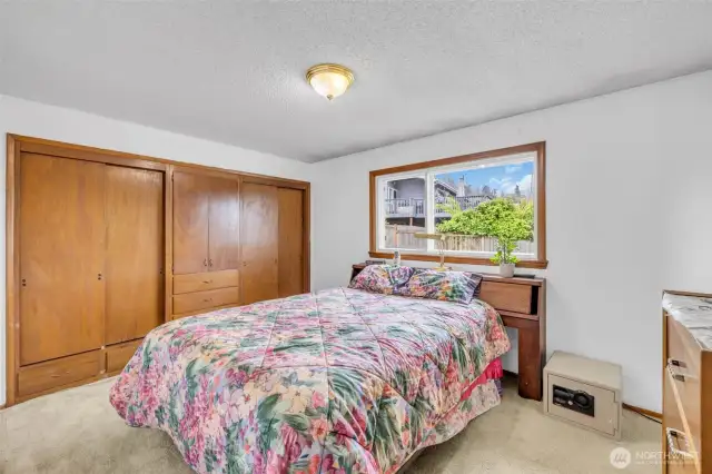 Primary Bedroom with closet built in shelves and drawers