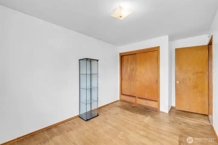 Main level Bedroom 1with closet built in shelves and drawers