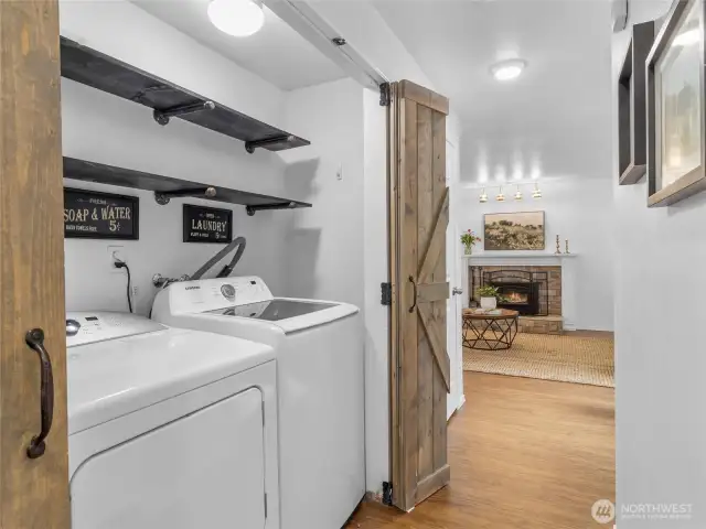 Washer/Dryer stay with home, tucked behind stylish barn doors in the hallway. Convenient location to all rooms.