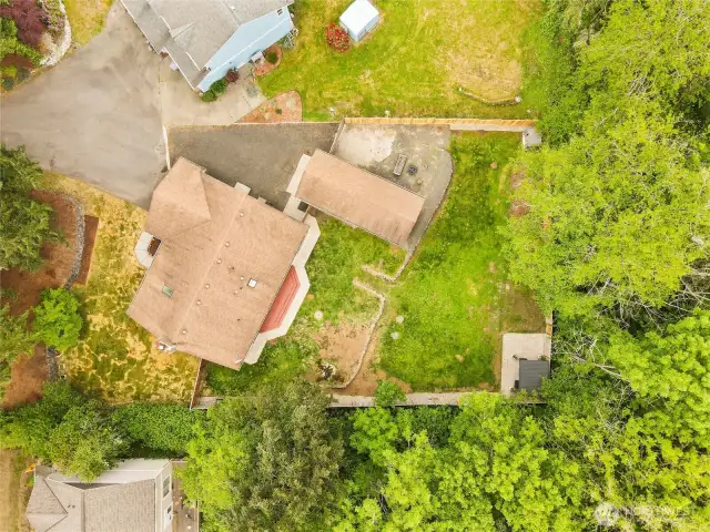 Surrounded by lush green trees creating privacy and serenity.