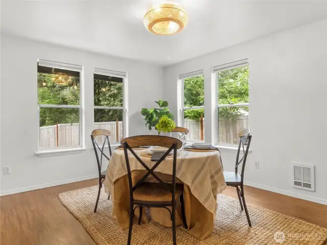 Ample dining space right off the kitchen with easy backyard access.