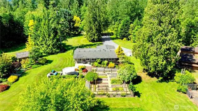 Studio/cabin in upper left and barn to the far right. Drive is shown at the top/center.