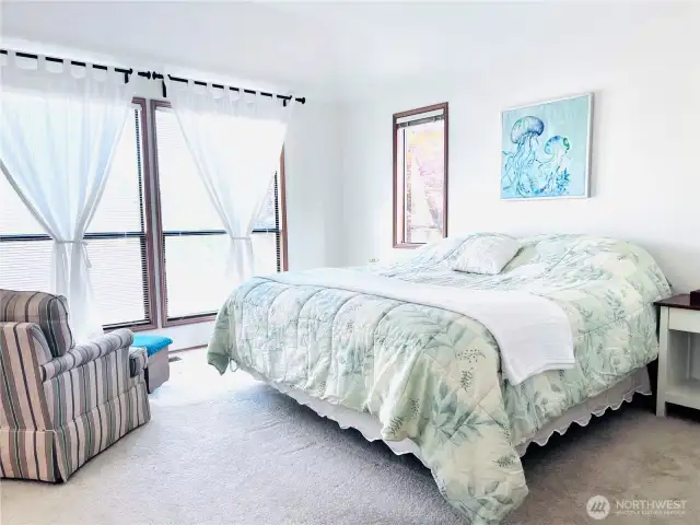Master bedroom looking towards southeast with floor to ceiling large windows