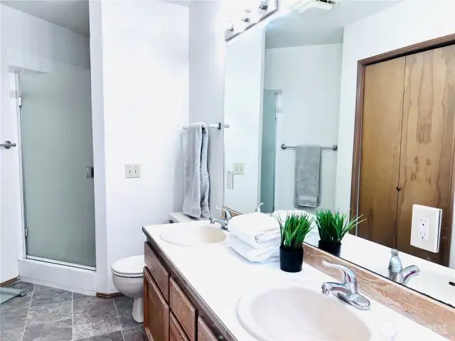 Master bathroom with full bath tub and shower. Double sinks. Newer tile floorings.