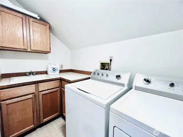 Laundry room with washer & dryer, storage cabinets, counter working space & sink