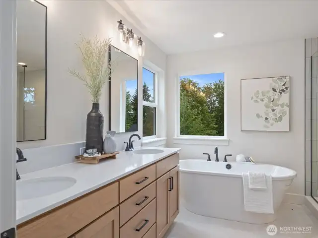 Stand alone soaking tub in primary bath.