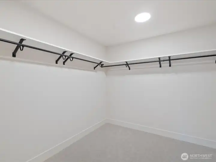 Huge walk in closet in primary bedroom.