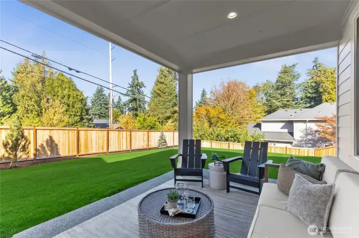 Outdoor living area backs to large beautiful backyard.