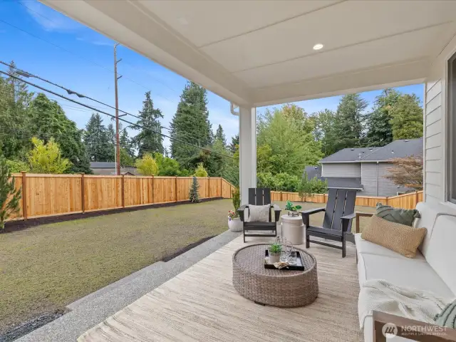 Outdoor, covered living area w/expansive back and side yard. Includes front & backyard irrigation.