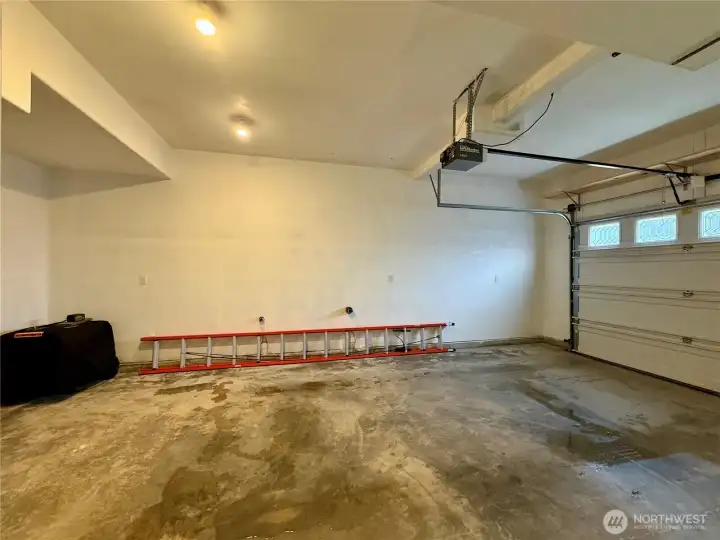 Double-wide garage with 2 single doors. Shop area.  Utility sink. Central heating Trane Variable Air Handler with Honeywell Electronic Cleaner. Wired to accommodate a generator with Honda engine.  Louisville LadderFiberglass extension ladder 28 ft 300-lb duty rating, type IA, FE3228.