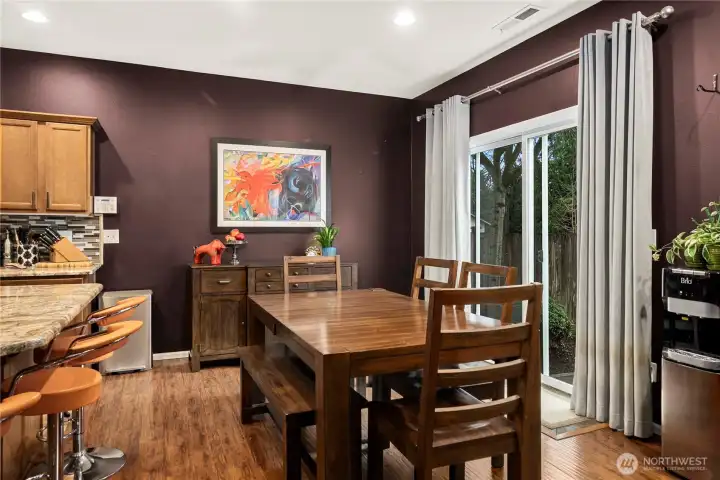 Dining room with slider leading out to the spacious private backyard