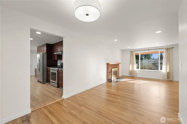 Bright and spacious dining room featuring a new light fixture