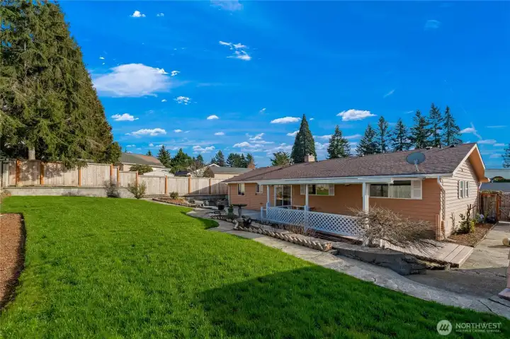 The entire backyard was thoughtfully redesigned to expand and enhance the usable outdoor space which now includes two patio areas. Improvements included new sod, newly installed planting beds, and the addition of privacy trees
