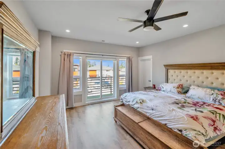 Upstairs primary bedroom with access to deck.
