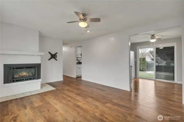 Cozy propane gas fireplace heats the entire living room & dining room areas.