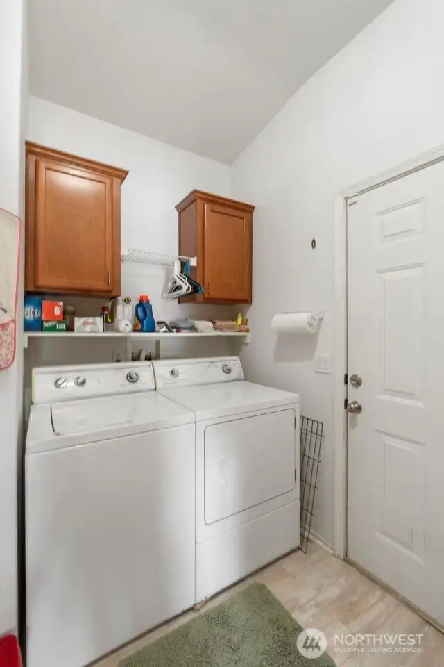 Laundry room with door to garage