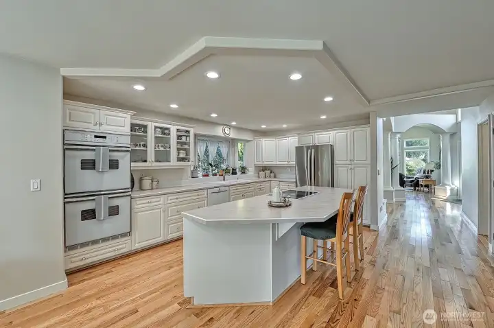 With double ovens, abundant cabinets space, and large island with eating counter - this will be a favorite room!