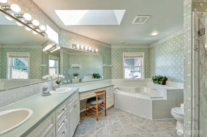 En Suite bathroom off of primary with jetted tub.