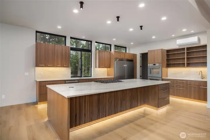 Simply stunning.  Hand-crafted cabinets with grain-matched walnut.