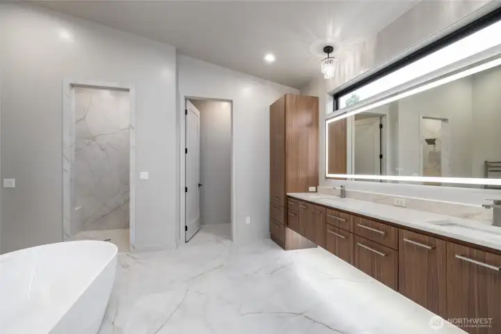 Exquisite primary bath - floating double vanity with clerestory windows for lots of natural light.