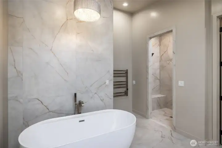Floor to ceiling porcelain tile.  Soaking tub, oversized shower, towel warmer.